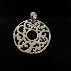 Cookie Lee silver tone round donut scroll vine pendant